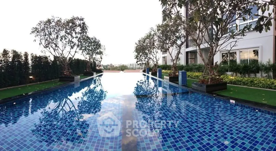 Luxurious residential pool with serene surroundings and modern design, perfect for relaxation and leisure.