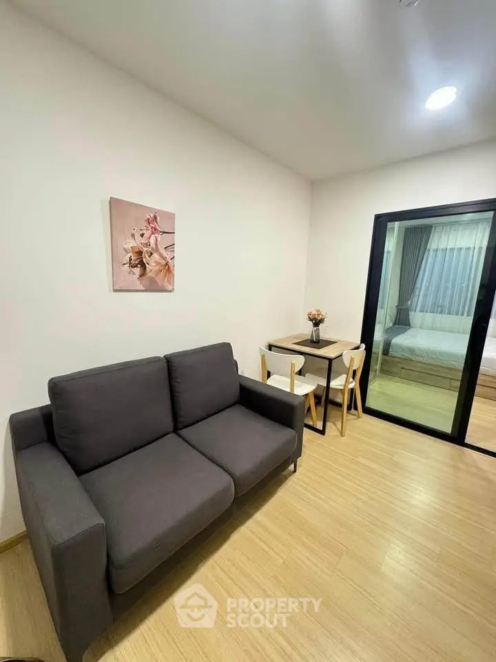 Modern living room with cozy sofa and dining area in stylish apartment