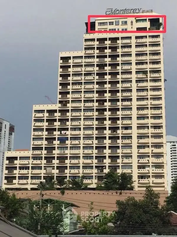 Stunning high-rise building with modern architecture and panoramic city views, perfect for urban living.
