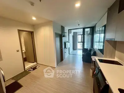 Modern apartment interior with open layout and sleek kitchen design