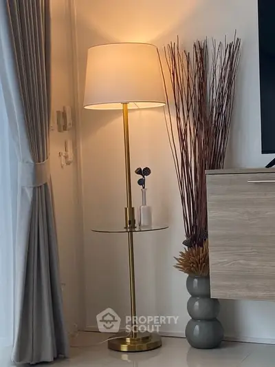 Elegant living room corner with modern floor lamp and stylish decor