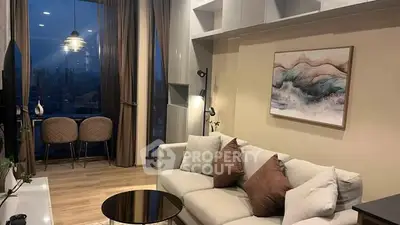 Modern living room with elegant decor and city view, featuring cozy seating and stylish lighting.