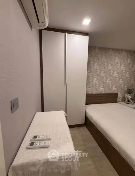 Cozy bedroom with modern air conditioning and stylish decor