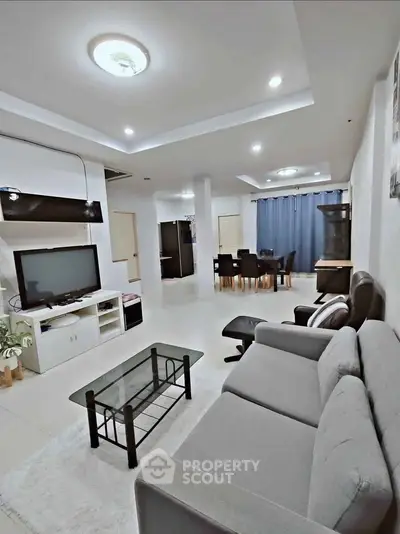 Spacious modern living room with elegant furniture and open layout