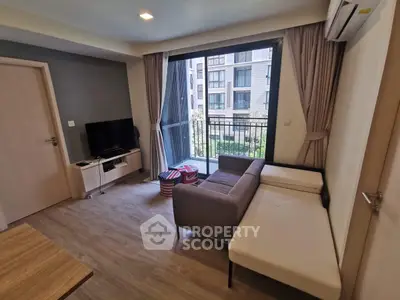 Modern living room with balcony view and stylish furniture