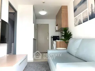 Modern living room with sleek furniture and stylish decor in a contemporary apartment.