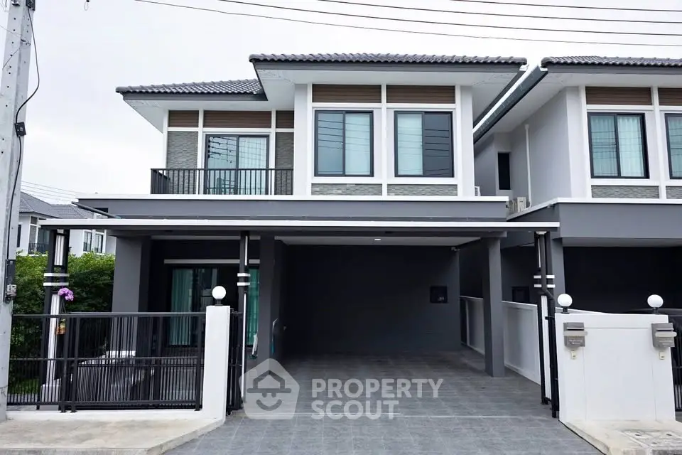 Modern two-story house with sleek design and spacious driveway