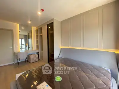 Modern bedroom with stylish decor and ample natural light