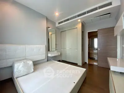 Modern bedroom with sleek design and ample storage space