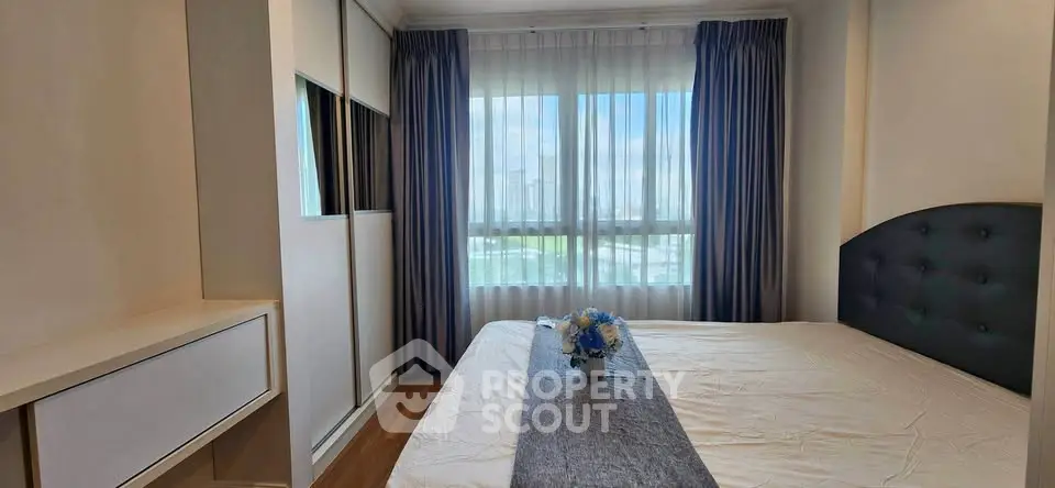 Bright and airy bedroom with large window and modern decor