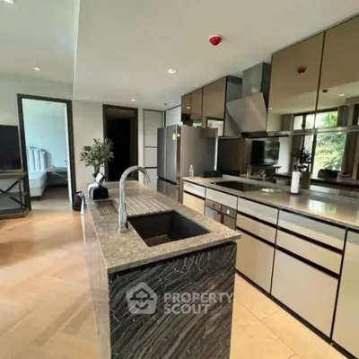 Luxurious modern kitchen with sleek design and high-end appliances, perfect for culinary enthusiasts.