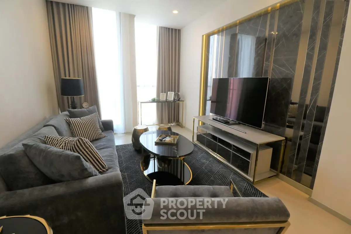 Luxurious modern living room with elegant decor and large TV