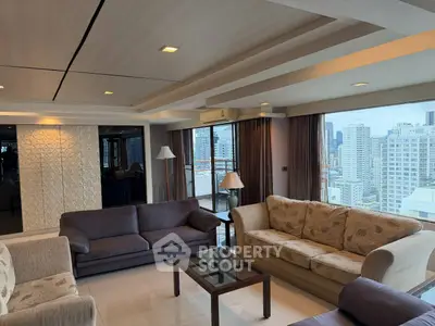 Spacious living room with panoramic city views and elegant furnishings