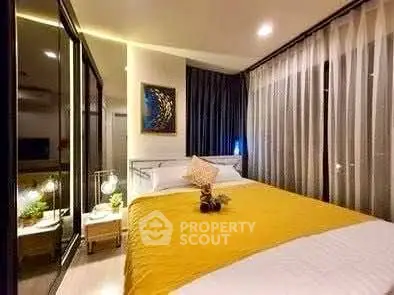 Modern bedroom with stylish decor and large windows in a cozy apartment.