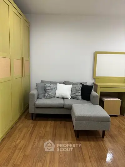 Cozy living room with modern sofa and wooden flooring