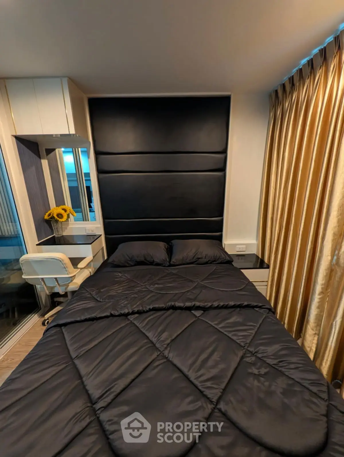 Modern bedroom with sleek black bedding and stylish decor