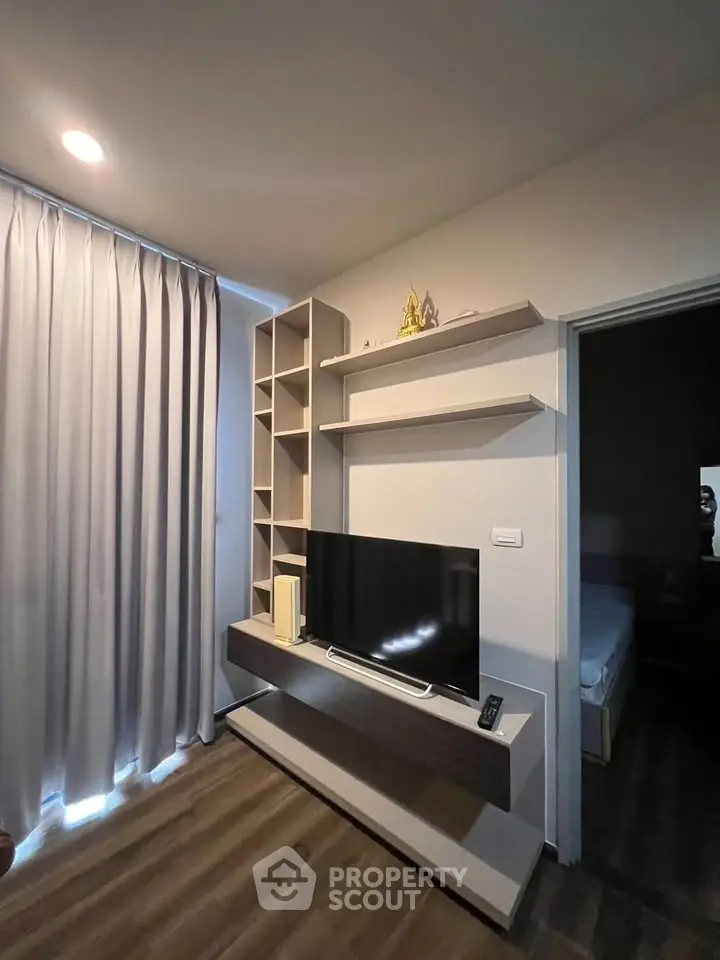 Modern living room with sleek TV unit and stylish shelving, perfect for contemporary living.