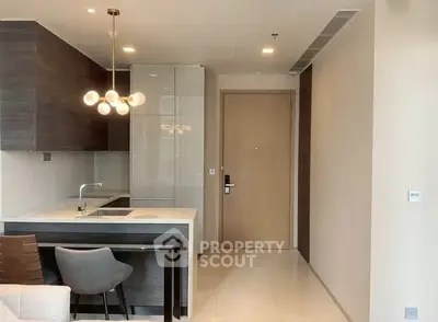 Modern open-layout kitchen with sleek cabinetry and stylish lighting