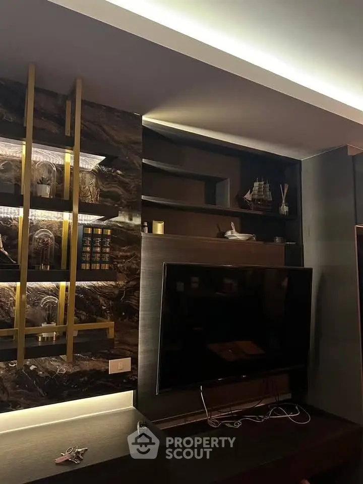 Luxurious living room with modern decor and large flat-screen TV