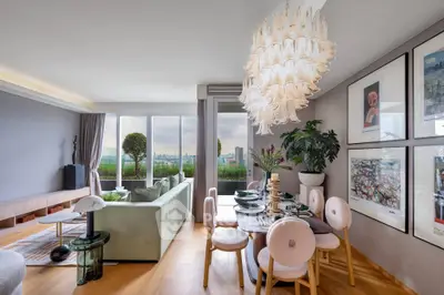 Luxurious living room with elegant chandelier and stunning city view