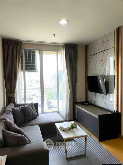 Modern living room with stylish decor and city view from balcony