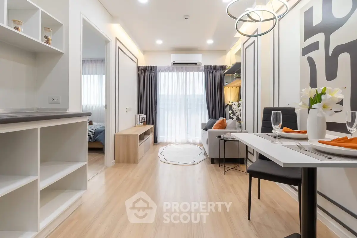Modern living room with elegant dining area and stylish decor in a contemporary apartment.