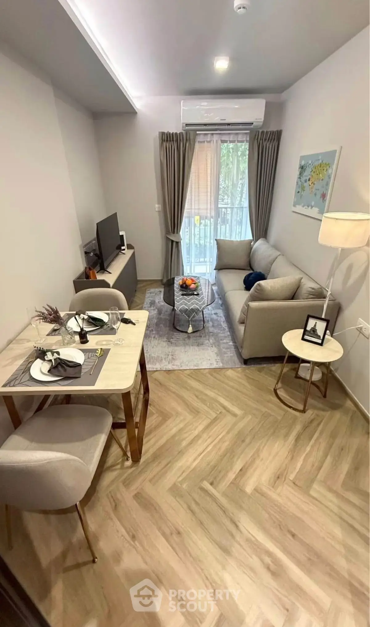 Chic living room with modern decor and cozy dining area, perfect for urban living.