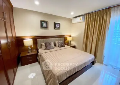 Luxurious bedroom with elegant decor and ample natural light