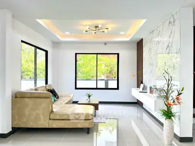 Modern living room with elegant sofa and marble accent wall