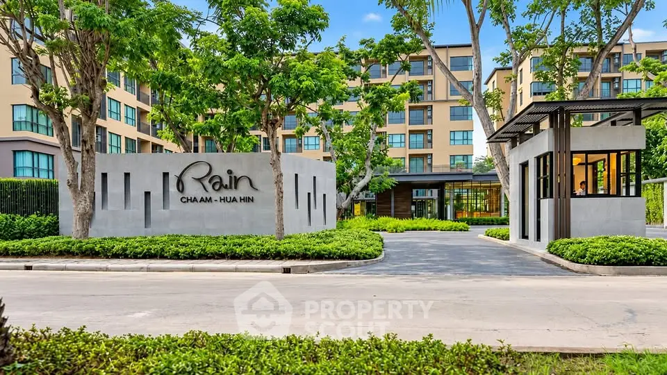 Modern condominium entrance with lush landscaping in Cha Am Hua Hin