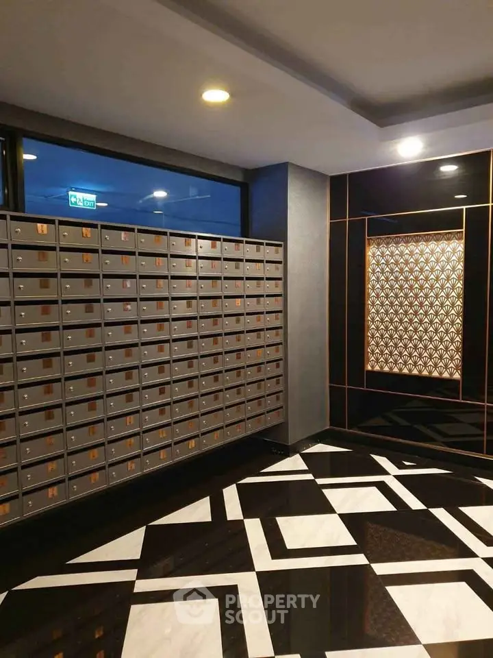 Luxurious apartment lobby with modern mailbox design and elegant flooring.