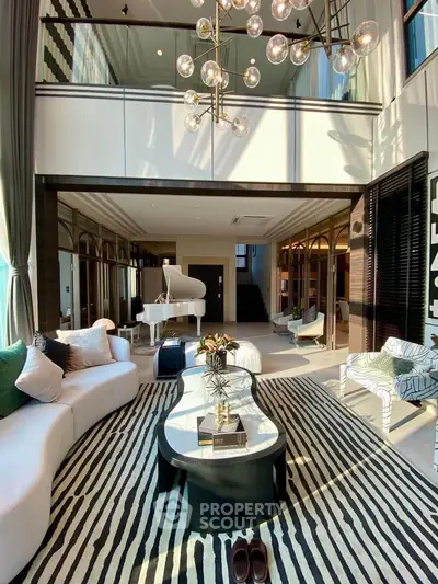 Luxurious living room with high ceilings, elegant decor, and grand piano, perfect for sophisticated living.