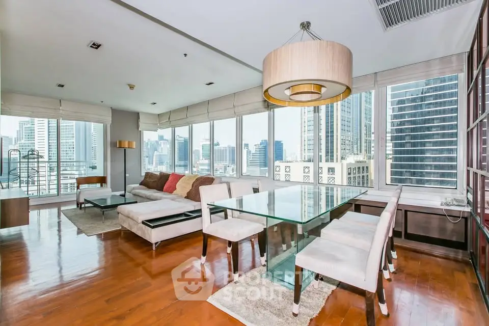 Luxurious high-rise living room with stunning city views and modern furnishings.