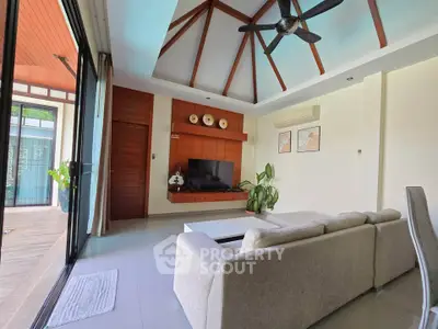 Spacious living room with vaulted ceiling and modern decor in a luxurious home.