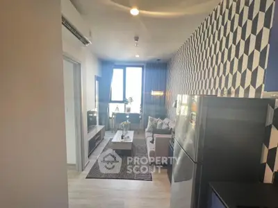 Modern living room with geometric wallpaper and cozy seating area