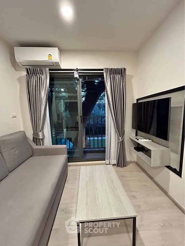 Modern living room with sleek design and balcony view