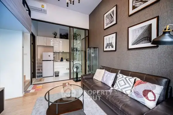 Modern living room with stylish decor and open kitchen layout