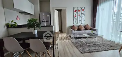 Modern open-plan living room with stylish decor and natural light