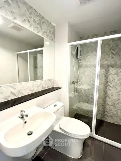 Modern bathroom with sleek design and glass shower enclosure