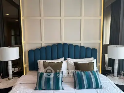 Luxurious bedroom with stylish headboard and elegant lighting