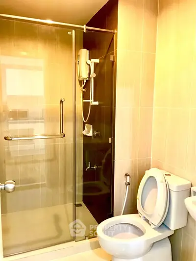 Modern bathroom with glass shower and sleek fixtures