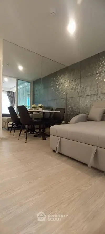 Modern living room with elegant dining area and stylish decor