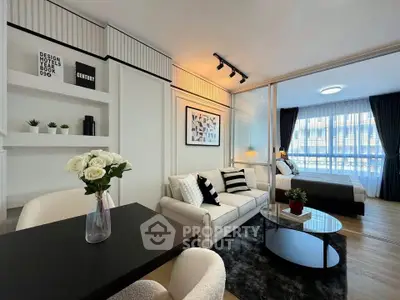 Modern open-plan living room with stylish decor and natural light