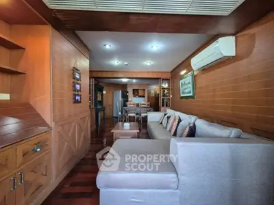 Spacious living room with wooden accents and modern furniture