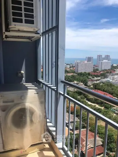 High-rise balcony with washing machine and stunning city and ocean view