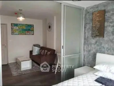 Modern studio apartment with stylish decor and sliding glass partition.