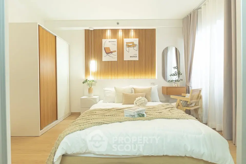 Cozy modern bedroom with stylish decor and natural light