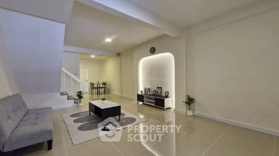 Spacious modern living room with sleek design and elegant lighting