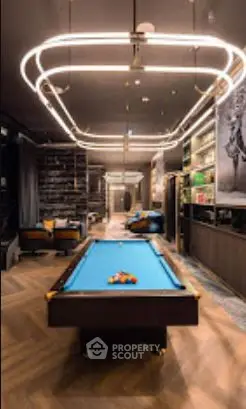Luxurious modern living room with pool table and stylish lighting