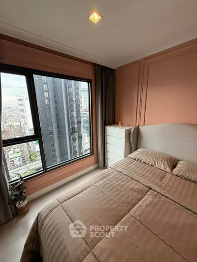 Modern bedroom with city view, featuring elegant decor and large window for natural light.